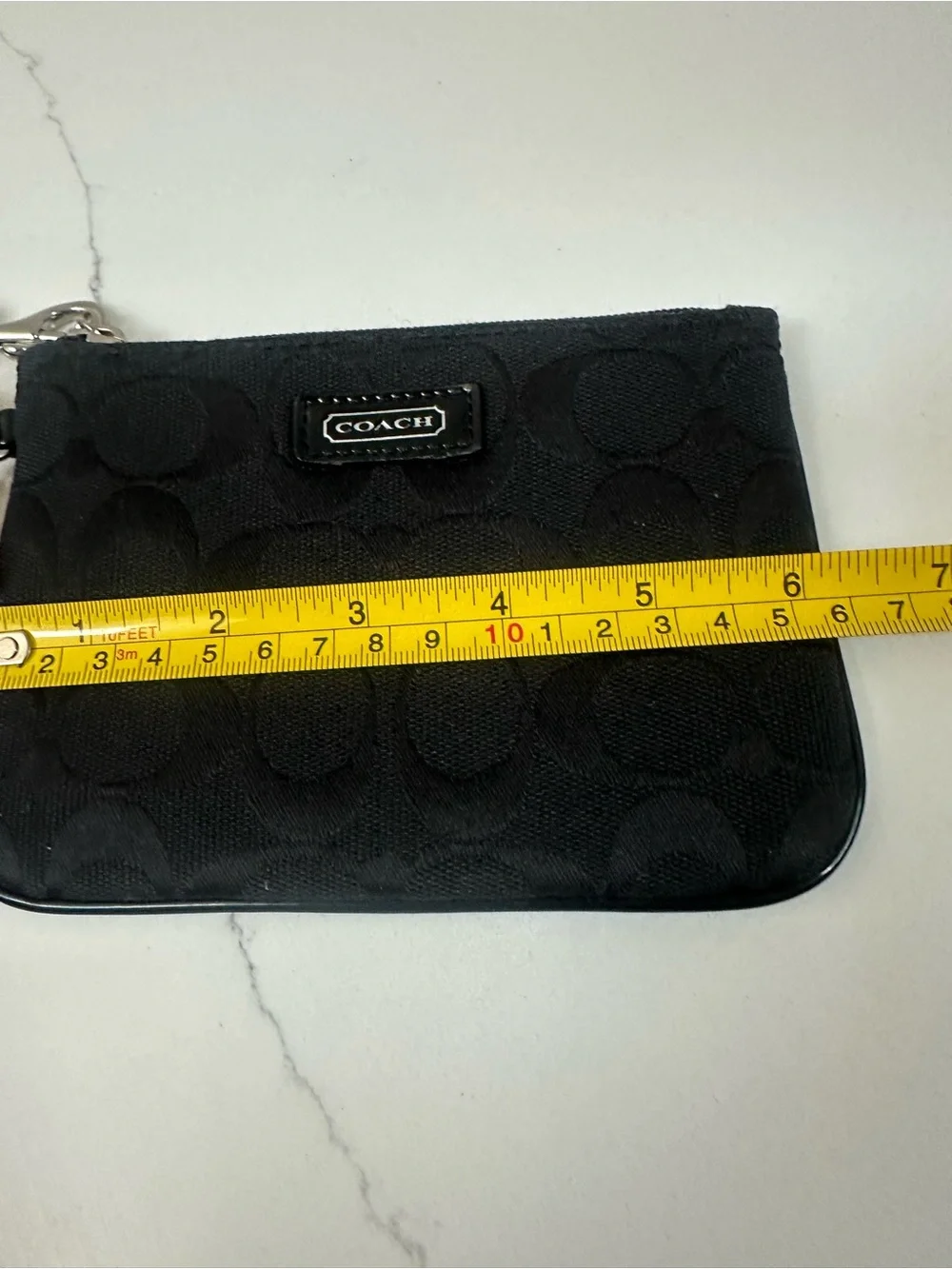 COACH Black Signature Wristlet with white coach tag